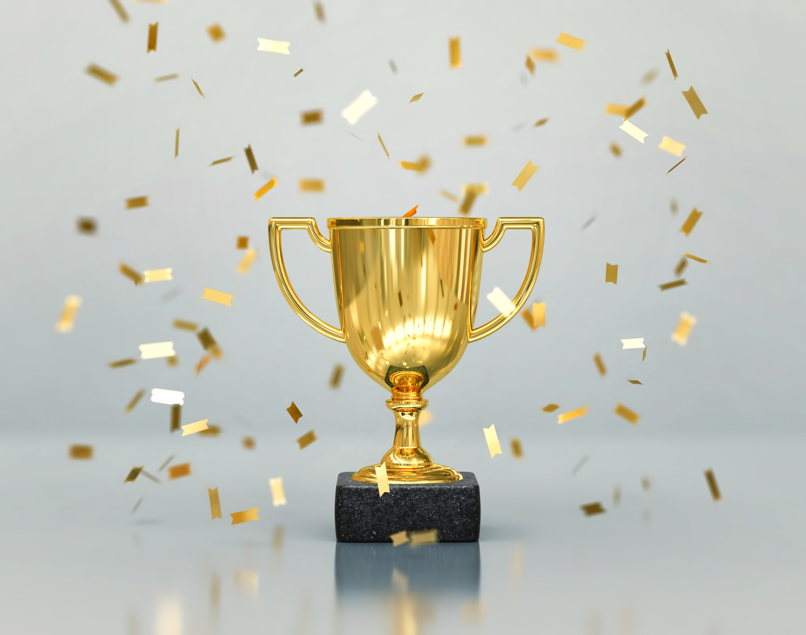 Gold winners trophy, champion cup with falling confetti on gray background. 3D rendering